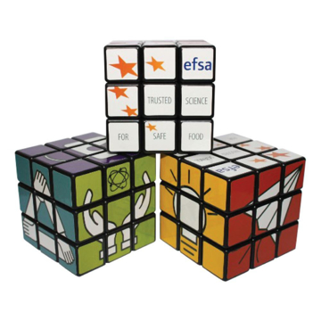 three rotating puzzle cubes stacked each with a full colour design to each different side