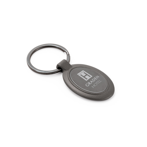 oval metal keyring in a dark grey metal with branding to the centre