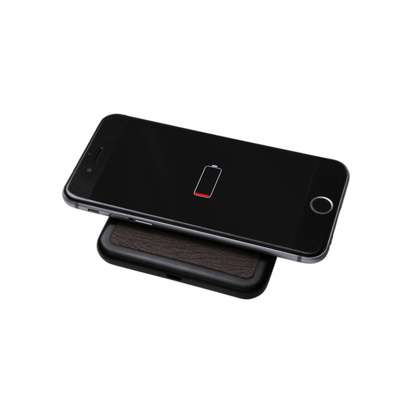Square wireless charging pad topping up a mobile phones battery
