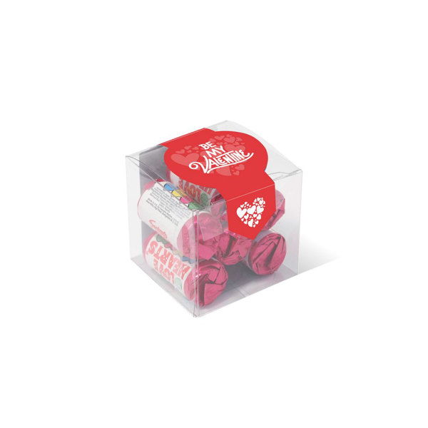 Love heart sweet rolls in a small clear cube sealed with a printed label