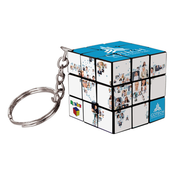 a 3 x3 square rubiks cube with a keychain to the corner