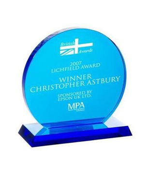 blue crystal award with white writing to the front