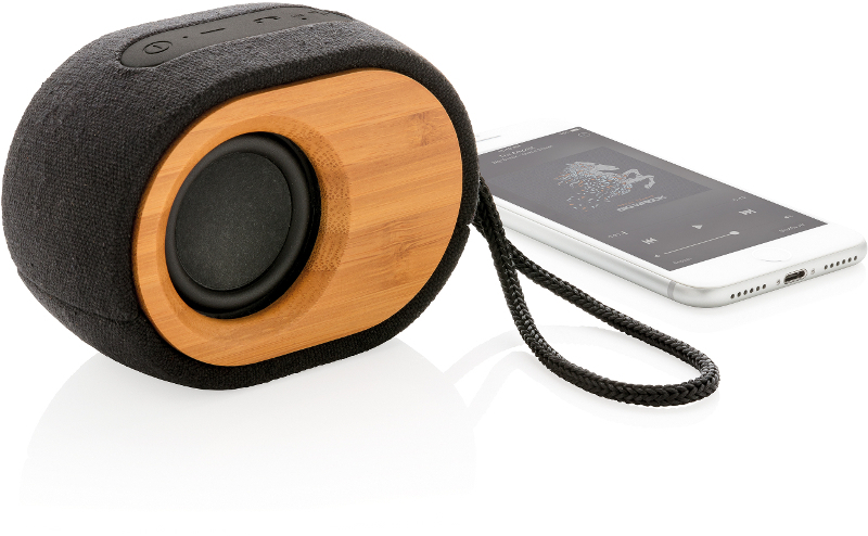Bamboo X Eco Bluetooth Speaker in bamboo and black with black strap with phone next to it