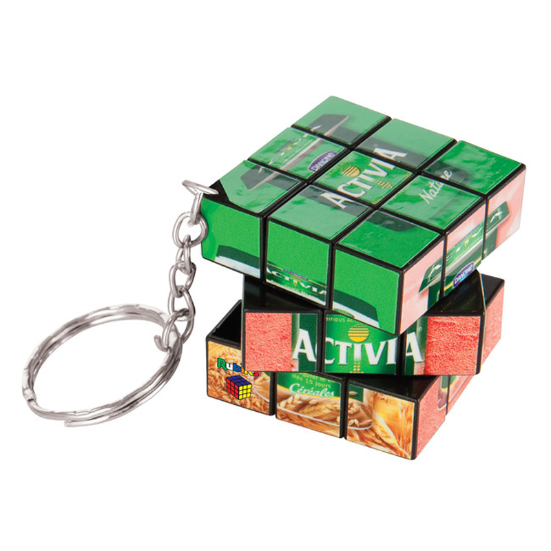 a 3x3 square rubiks cube being twisted around with a keychain to the corner