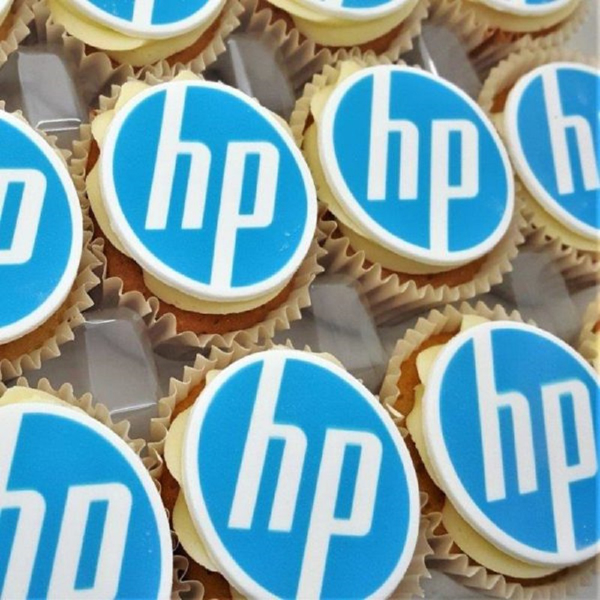 Iced cupcakes with personalised toppers printed with a company logo