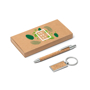 a car box with a green leaf branding next to a cork pen and keyring