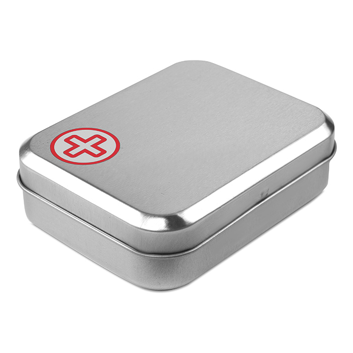 closed angled view of silver first aid kit tin with red cross label to corner
