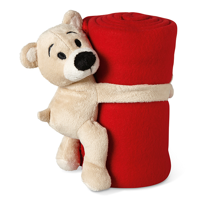 teddy bear holding red blanket