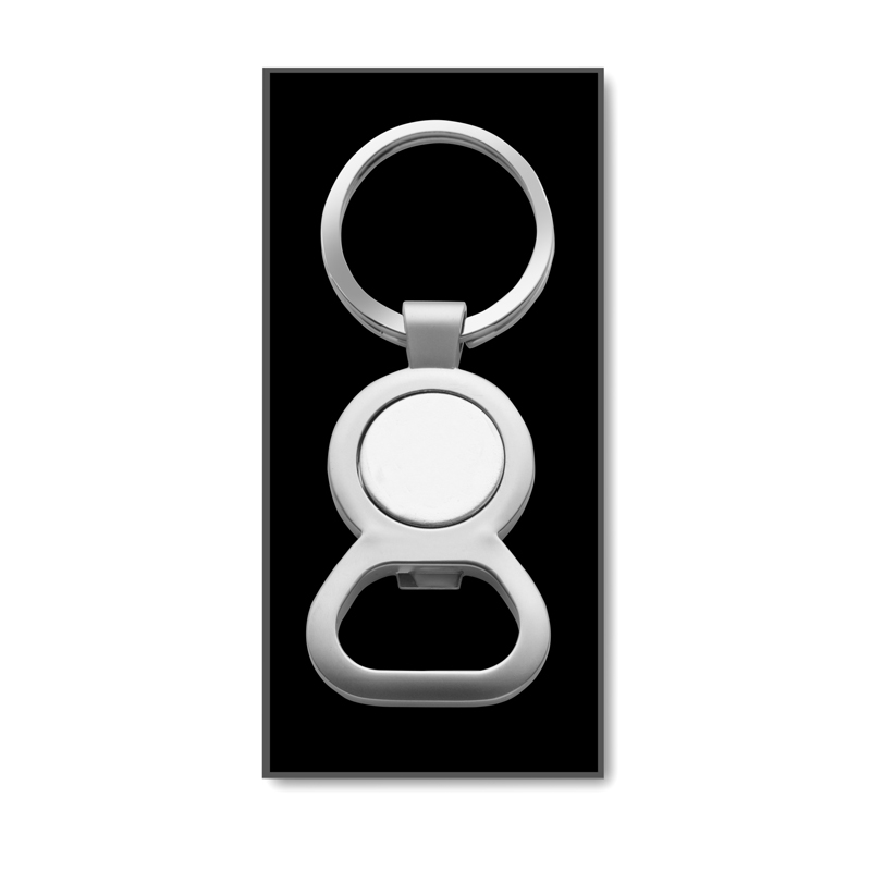 a solid metal keyring with a branded engraved trolley disk to the centre and a bottle opener to one end in a black gift box