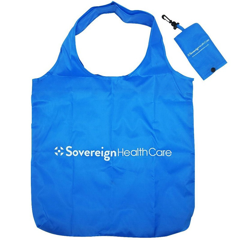 Blue foldable shopper bag with branding to the front and storage pouch