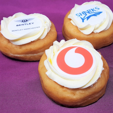 frosted doughnuts with icing topper branded with a company logo