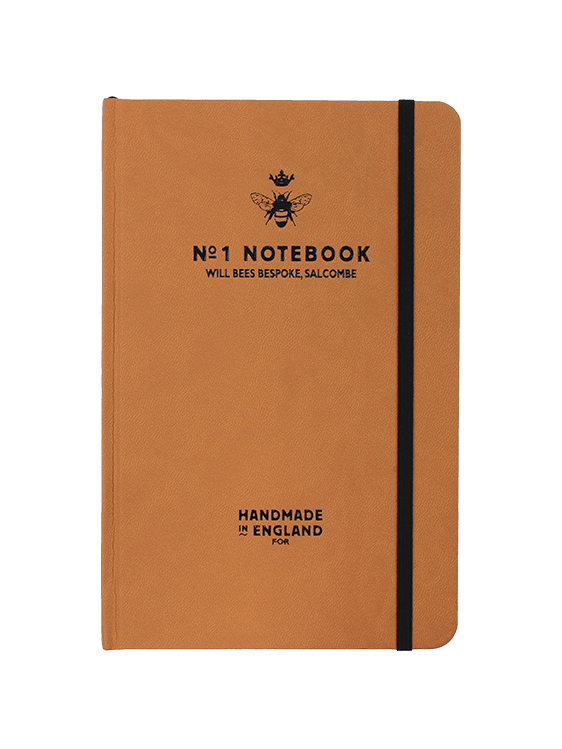 Will Bees Quarto Notebook in tan with black elastic closure strap and black embossed logo