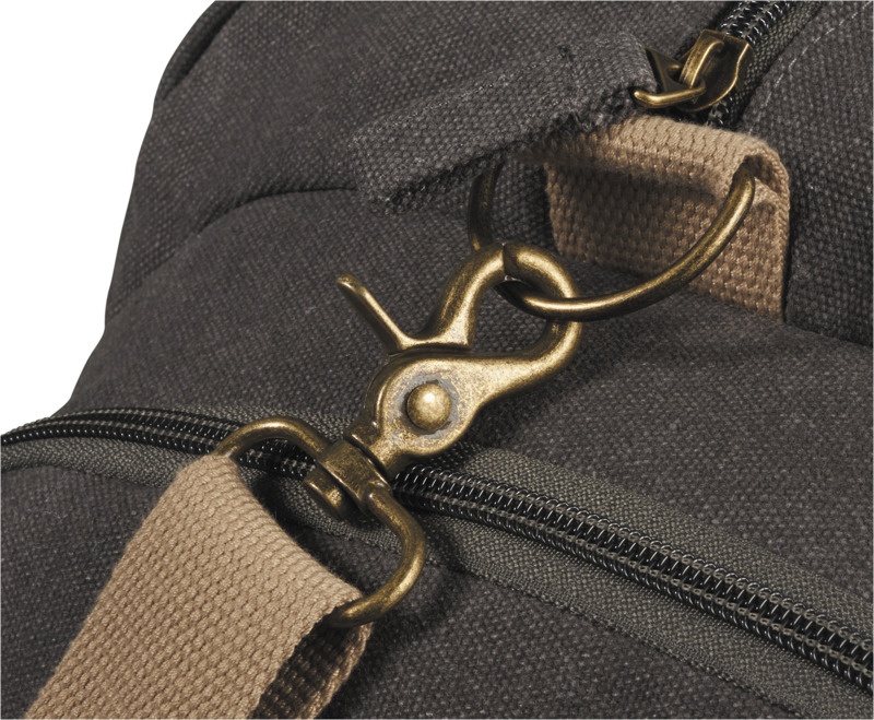 Venture Duffel Bag in charcoal with cream straps showing metal clasp details