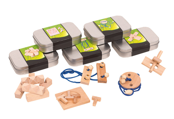 a selection of tins with a full colour branded paper wrap each containing a random mix of wooden puzzle games 