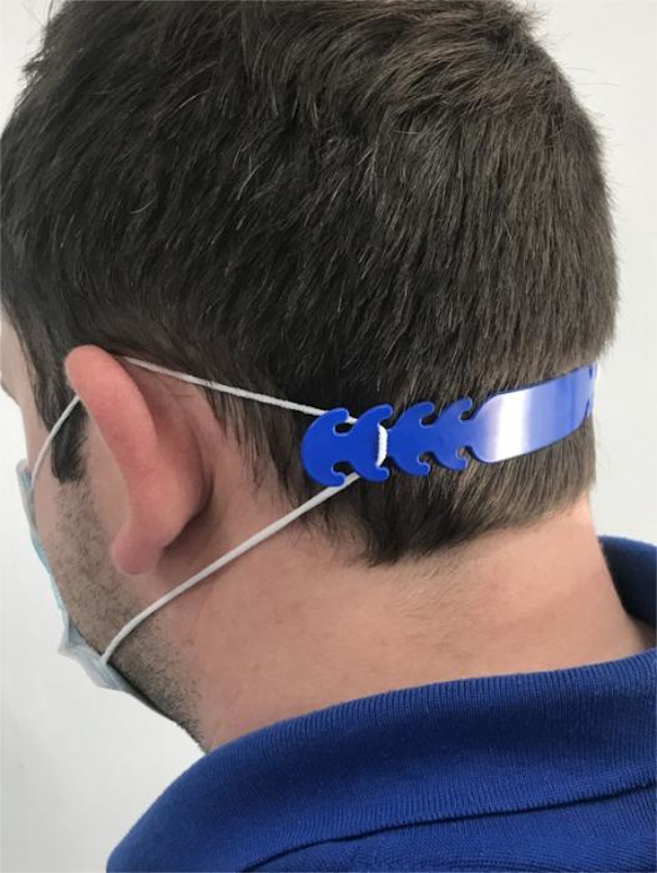 Face Mask Comfort Strap in blue showing it round the side of his head