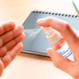 a small spray hand sanitiser in use spraying hands