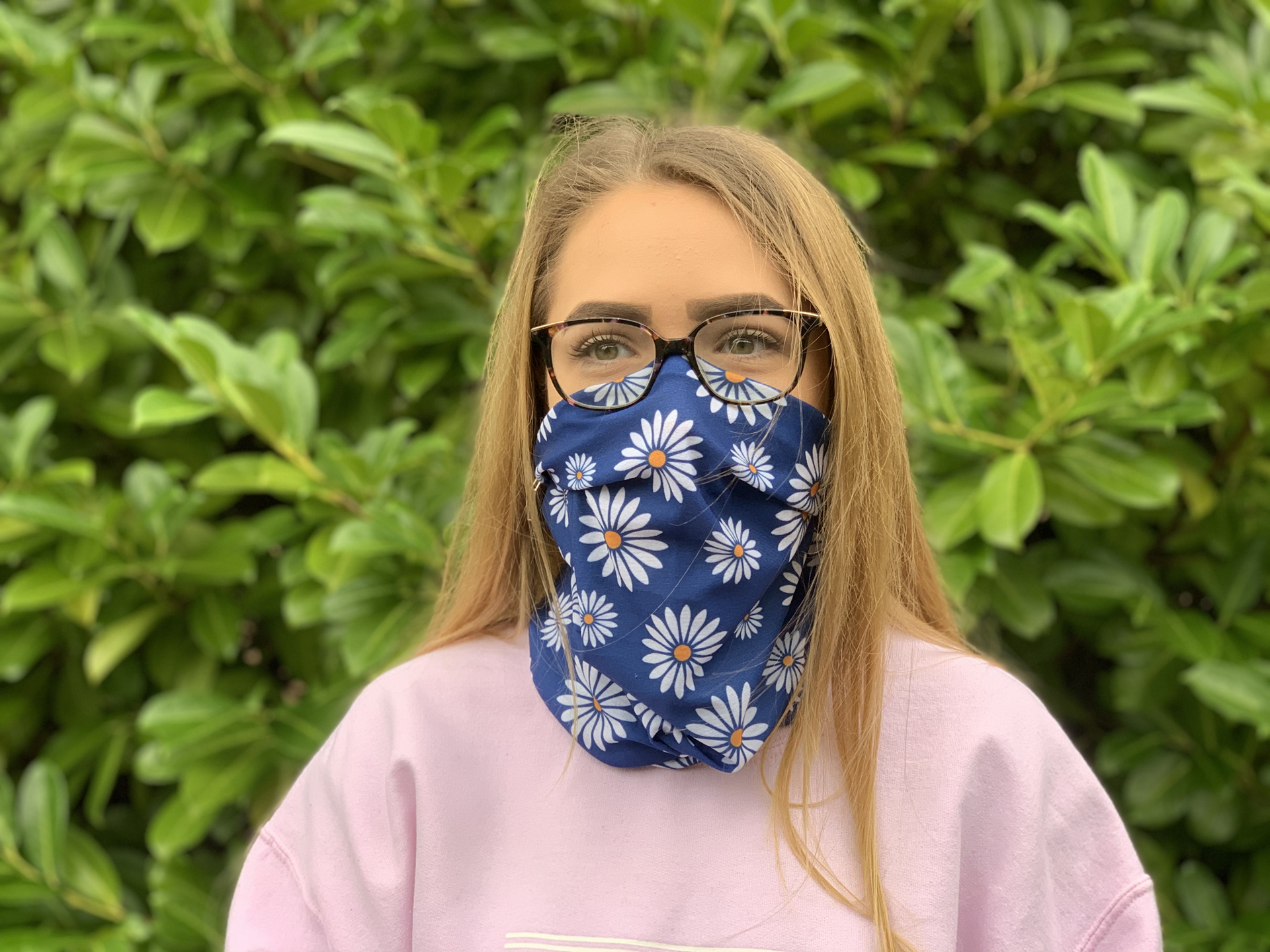 girl wearing full colour printed snood with all over daisy design