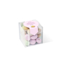Speckled chocolate eggs in a clear cube personalised with a pink printed sticker