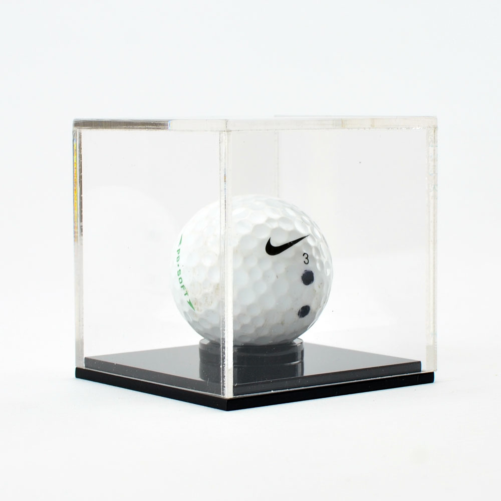 Golf Ball Display Case with golf ball on black base
