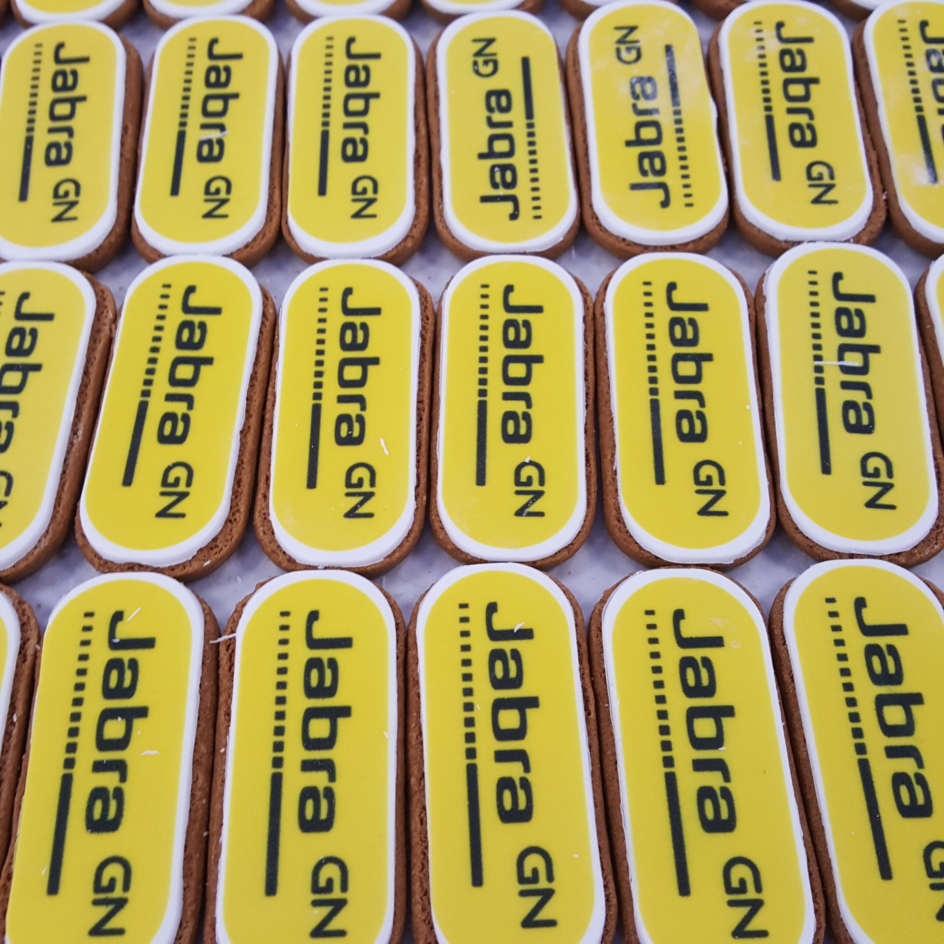 oval biscuits with yellow full colour logo topper