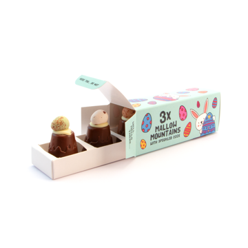 eco sliding box filled with 3 mallow mountains topped with speckled eggs