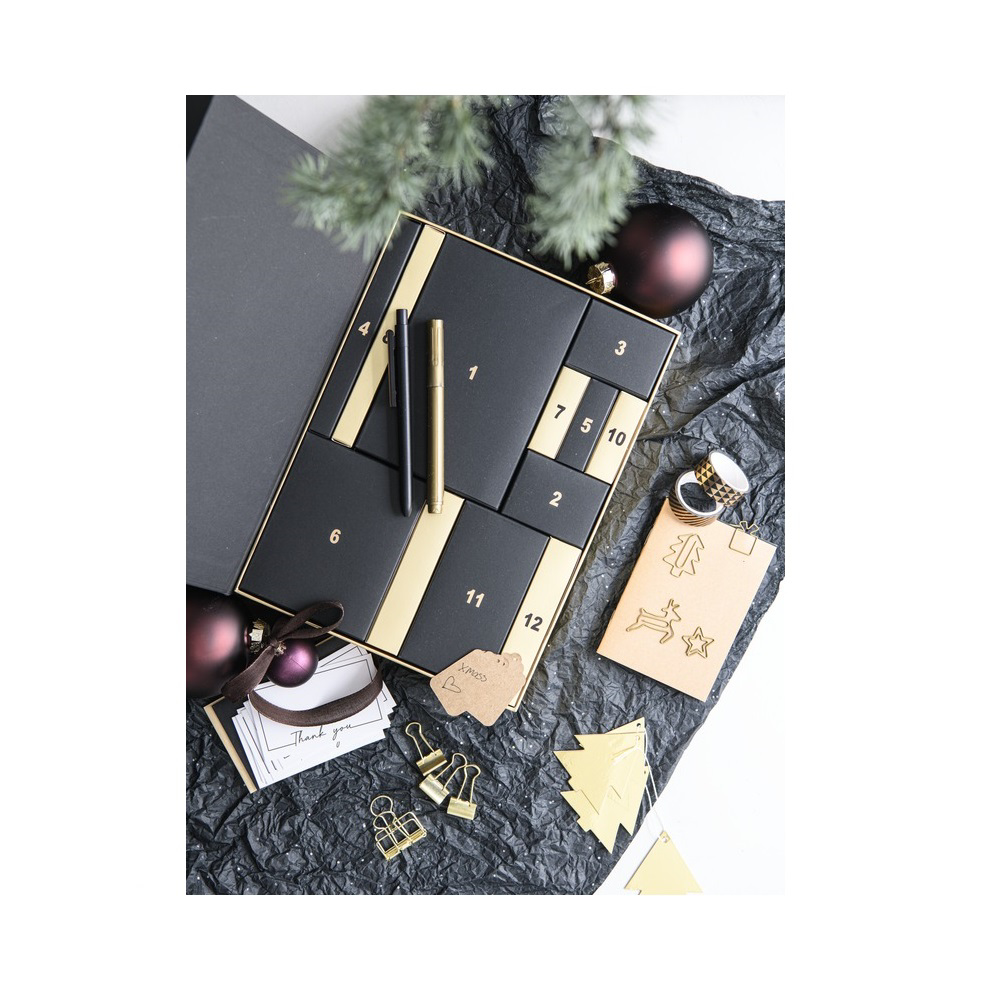 black and gold advent calendar filled with stationery items