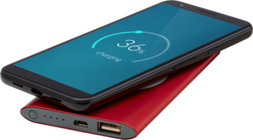 Red wireless power bank in use