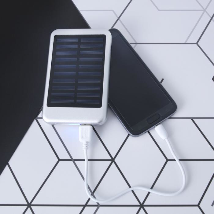 Solar Power Bank with print in use on a table