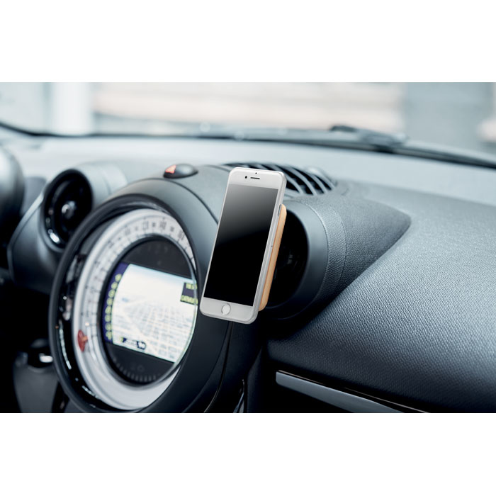 bamboo wireless charger in use in the car