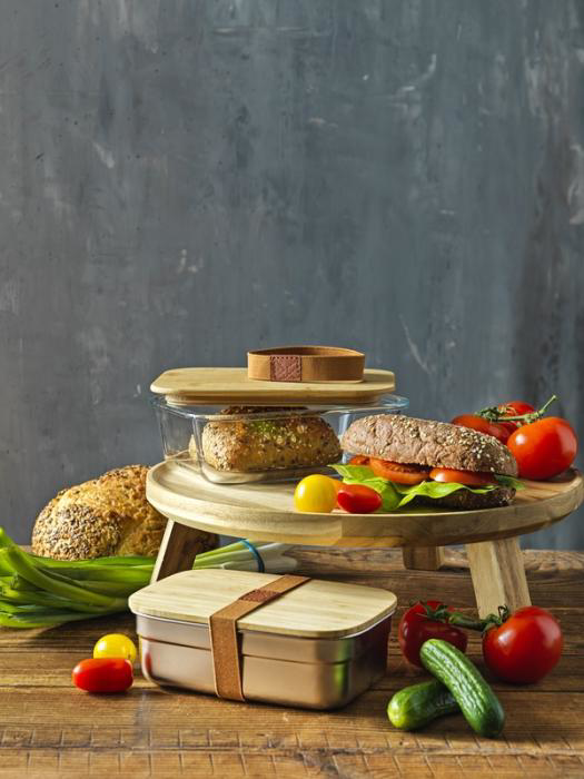 Glass lunch box with bamboo lid in use
