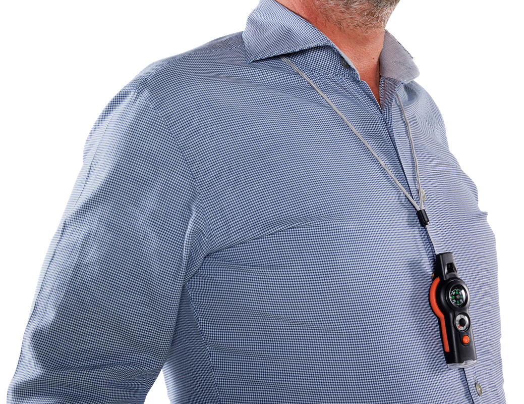 The survival tool being worn around a man's neck, main body of the tool is black and the sides are orange.