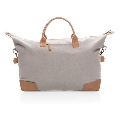 Light grey weekend duffle bag, with light brown handles and patches on the corners 