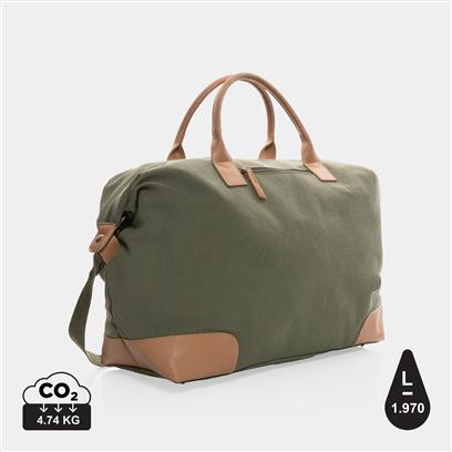 green weekend duffle bag, with light brown handles and patches on the corners 