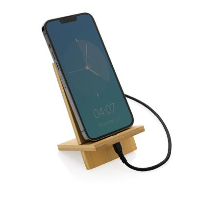 Light brown bamboo phone stand with a phone being charged on the stand (forwards facing)