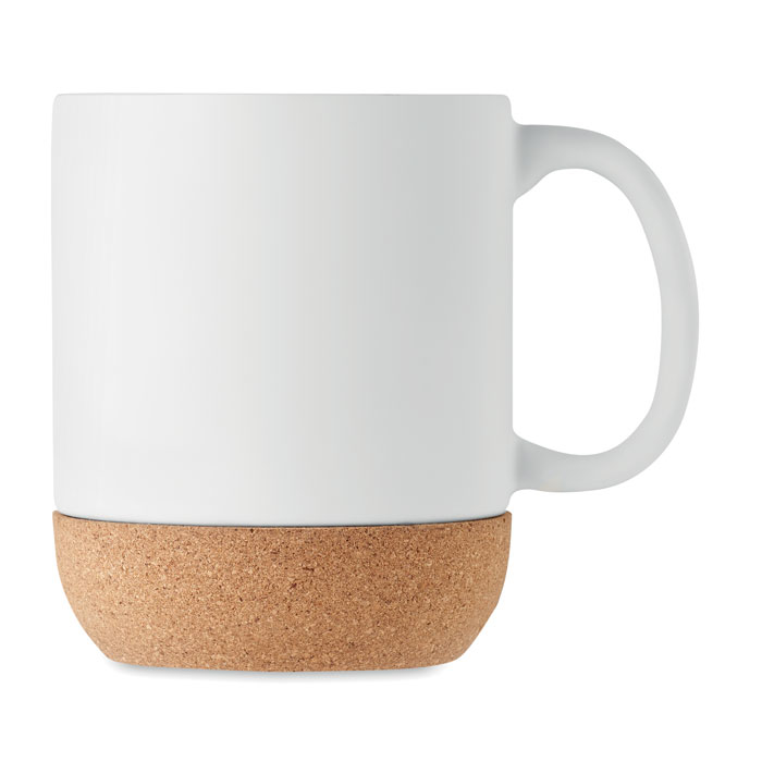 A white ceramic mug with a handle on the right and a light brown cork base 