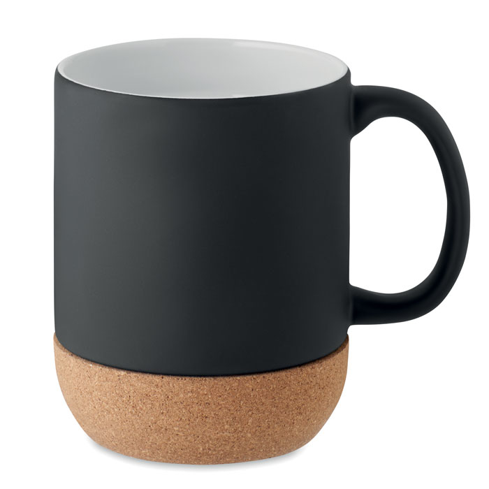 A black ceramic mug with a handle on the right and a light brown cork base