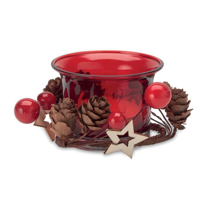 A red christmas candle that has ornaments surrounding the base