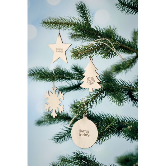 A light brown wooden snowflake hanging on the Christmas tree