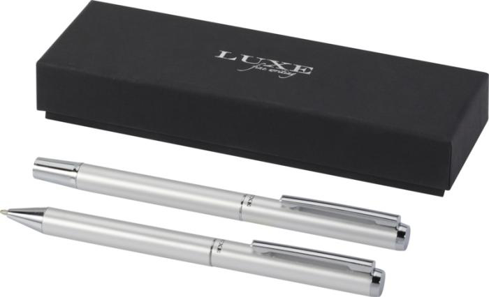 white pens and a sleek black box