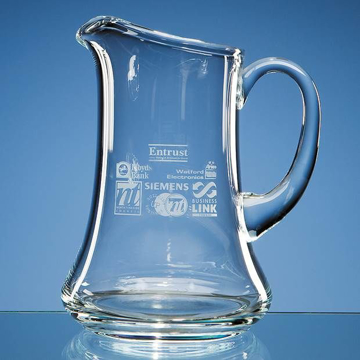 Clear glass jug with handle on the right