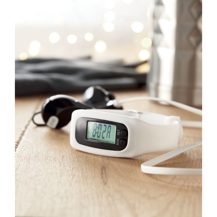White Pedometer with a green screen and black outer edge displayed on a desktop