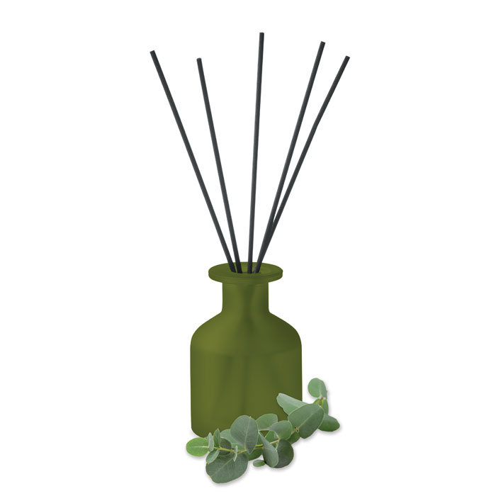 green fragrance stick diffuser with flower of scent next to it 