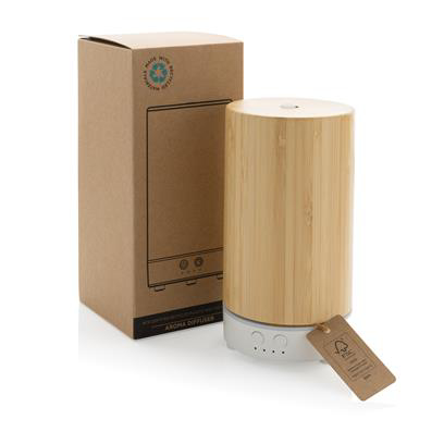 Light brown diffuser with a white base, cylinder shape, shown next to its packaging