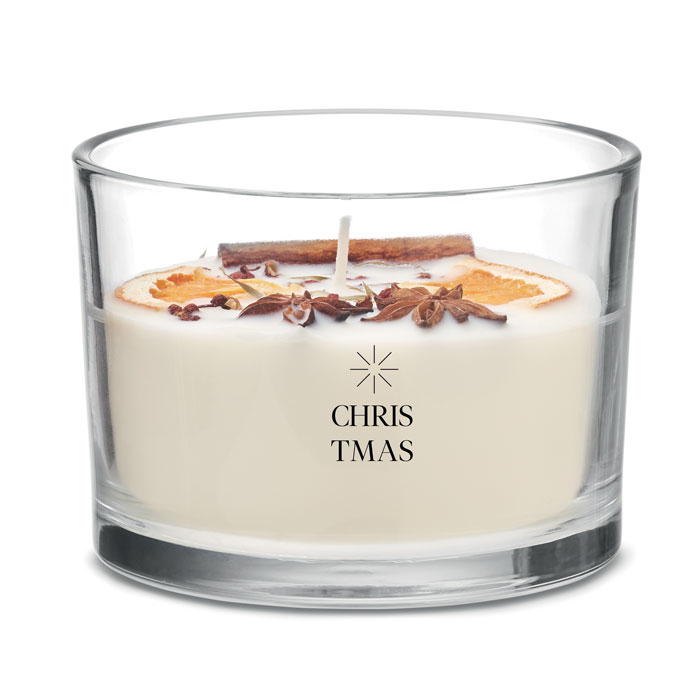 A cream coloured candle with orange fruits and leaves on top in a transparent glass jar (with personalisation)