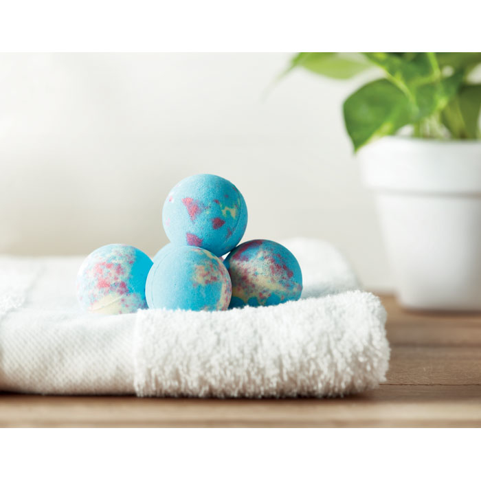 five blue bath bombs on a towel