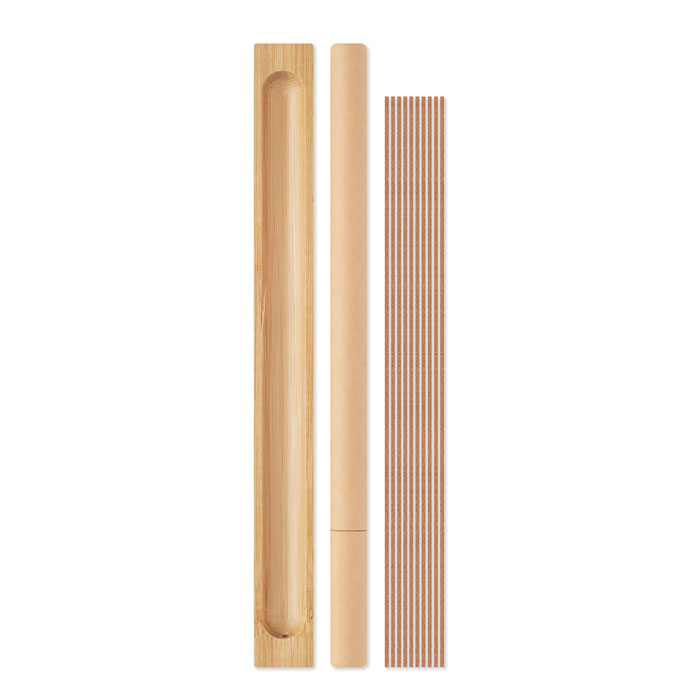 a light brown rectangular bamboo holder with incense sticks and its packaging