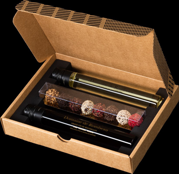 Three wine tubes and chocolates in brown packaging