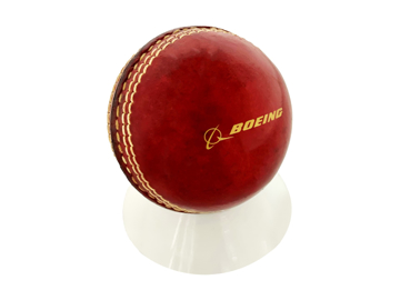 cricket ball in a white stand