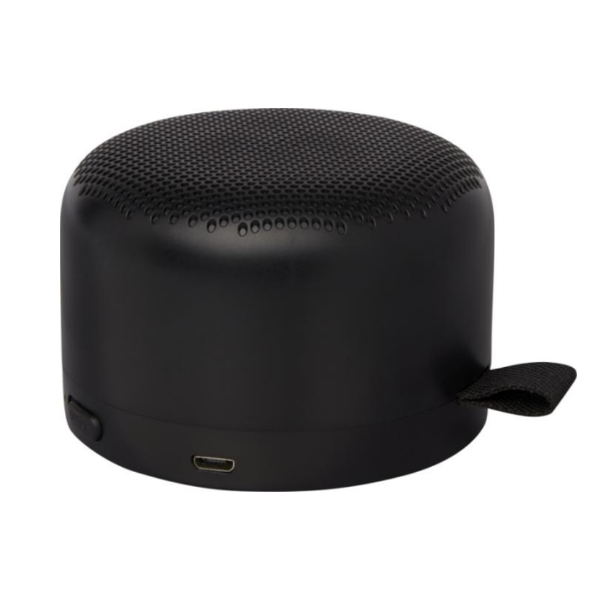 	A black circular bluetooth speaker