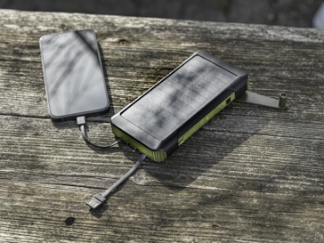 Show details for Soldy 10.000 mAh RCS recycled plastic solar dynamo power bank Recycled Plastic Solar Power Bank in use